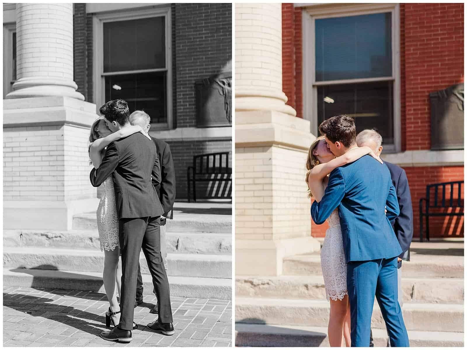 Couple shares their first kiss as husband and wife in front of augusta county courthouse in downtown staunton after their elopment ceremony.