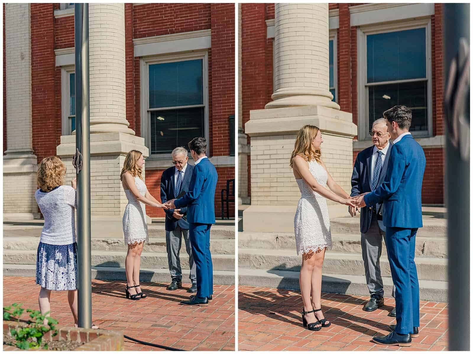 Couple stand holding hands and looking at their elopement officiant on the steps of the augusta county courthouse in downtown Staunton VA on a summer morning. The Bride's mother is standing nearby taking photographs on her cell phone.