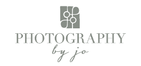 Logo with text "Photography by Jo" and a camera icon above.