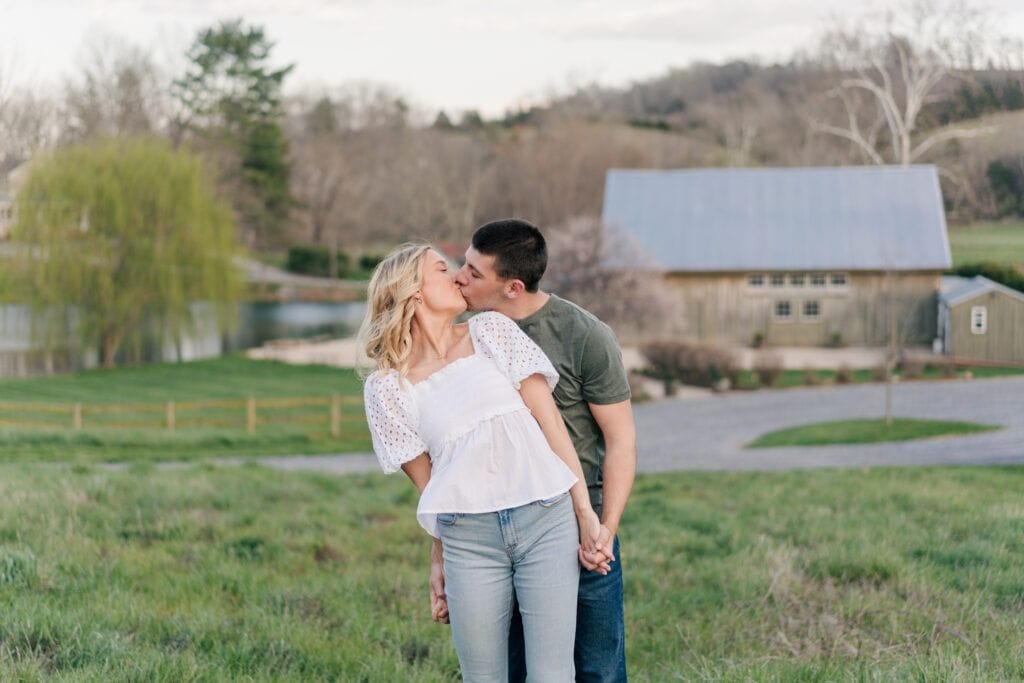 Couple embraces in front of the mountain views in Lexington VA