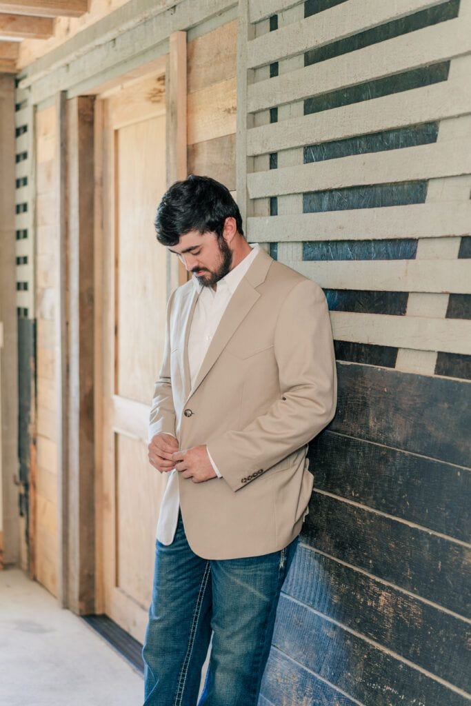 Groom preparing for wedding ceremony at Sky Ridge Farm, a barn wedding venue in Waynesboro, VA, near the Blue Ridge Mountains. Photo by Wedding Phootography by Jo Mahaney, a Virginia wedding photographer.