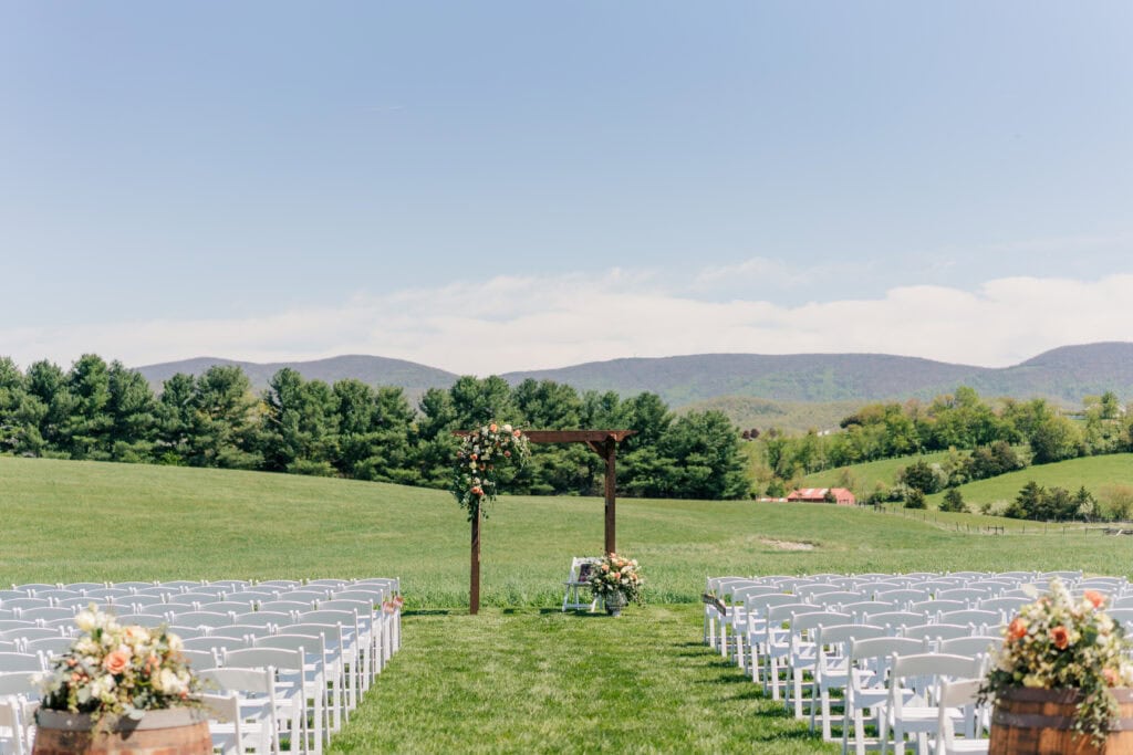 View of the Blue Ridge Mountains behind the barn at Sky Ridge Farm, a barn wedding venue in Waynesboro, VA, near the Blue Ridge Mountains. Photo by Wedding Phootography by Jo Mahaney, a Virginia wedding photographer.