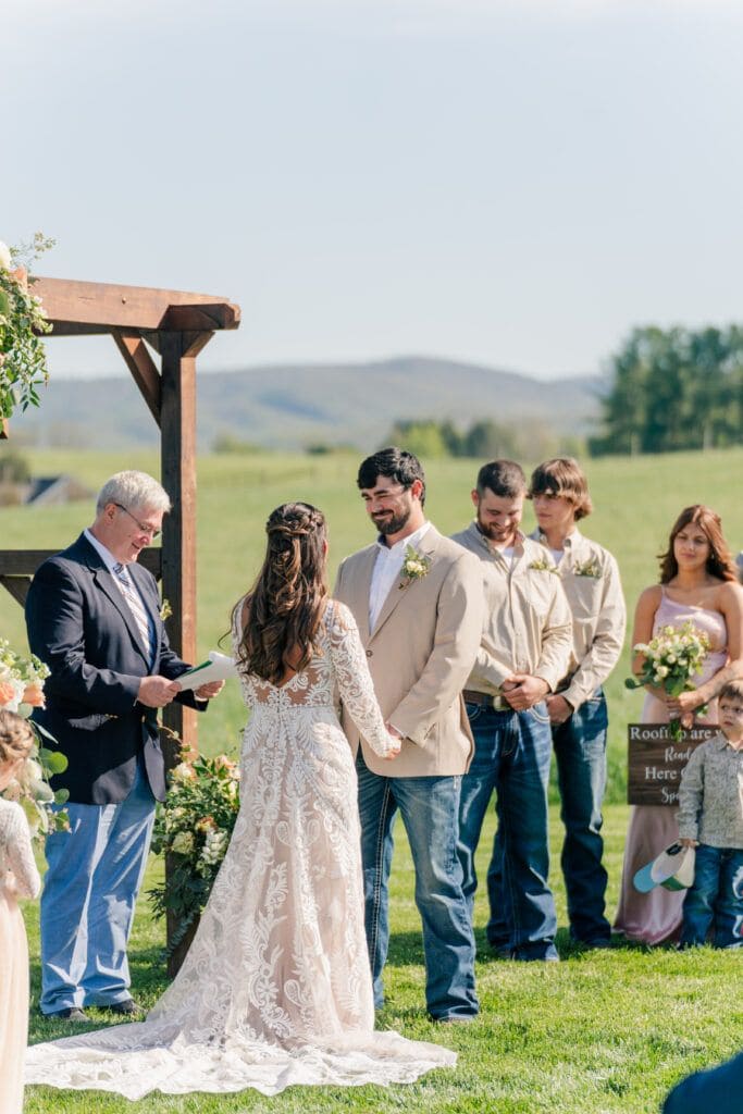 Wedding vow exchange at Sky Ridge Farm, a barn wedding venue in Waynesboro, VA, near the Blue Ridge Mountains. Photo by Wedding Phootography by Jo Mahaney, a Virginia wedding photographer.