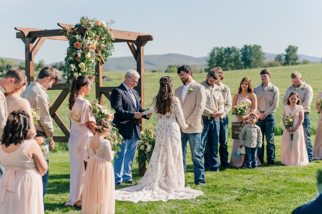 Summer wedding ceremony at Sky Ridge Farm, a barn wedding venue in Waynesboro, VA, near the Blue Ridge Mountains. Photo by Wedding Phootography by Jo Mahaney, a Virginia wedding photographer.