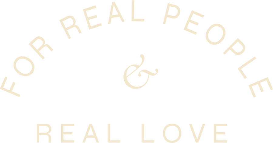 Curved text reads FOR REAL PEOPLE & REAL LOVE in a light, pale font on a plain light background.