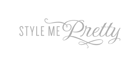 Style Me Pretty logo with Style Me in uppercase sans-serif font and Pretty in elegant cursive script, all in a gray color on a transparent background.